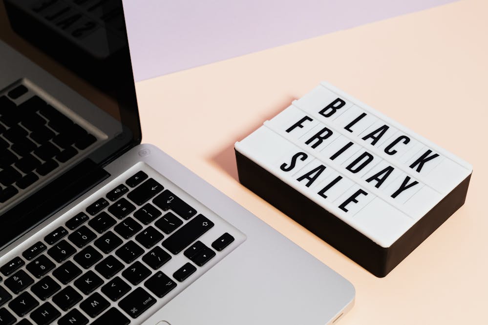 Best Black Friday deals: A Black Friday sign next to a laptop