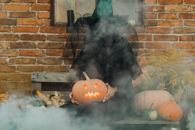 Halloween party theme ideas: A person dressed as a witch for Halloween