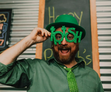 A man celebrating St. Patrick's Day wearing green
