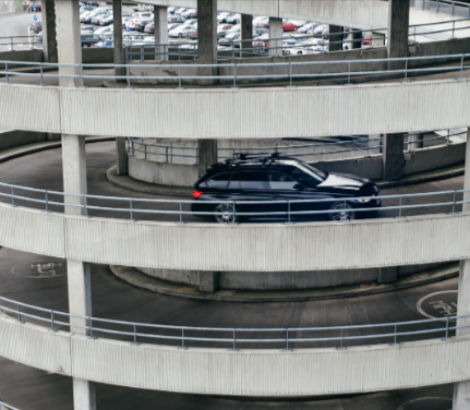 A car parking in a parking lot at Edinburgh Airport