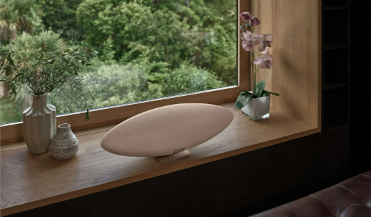 The Bowers & Wilkins Zeppelin Pro Edition in solar gold in a lounge