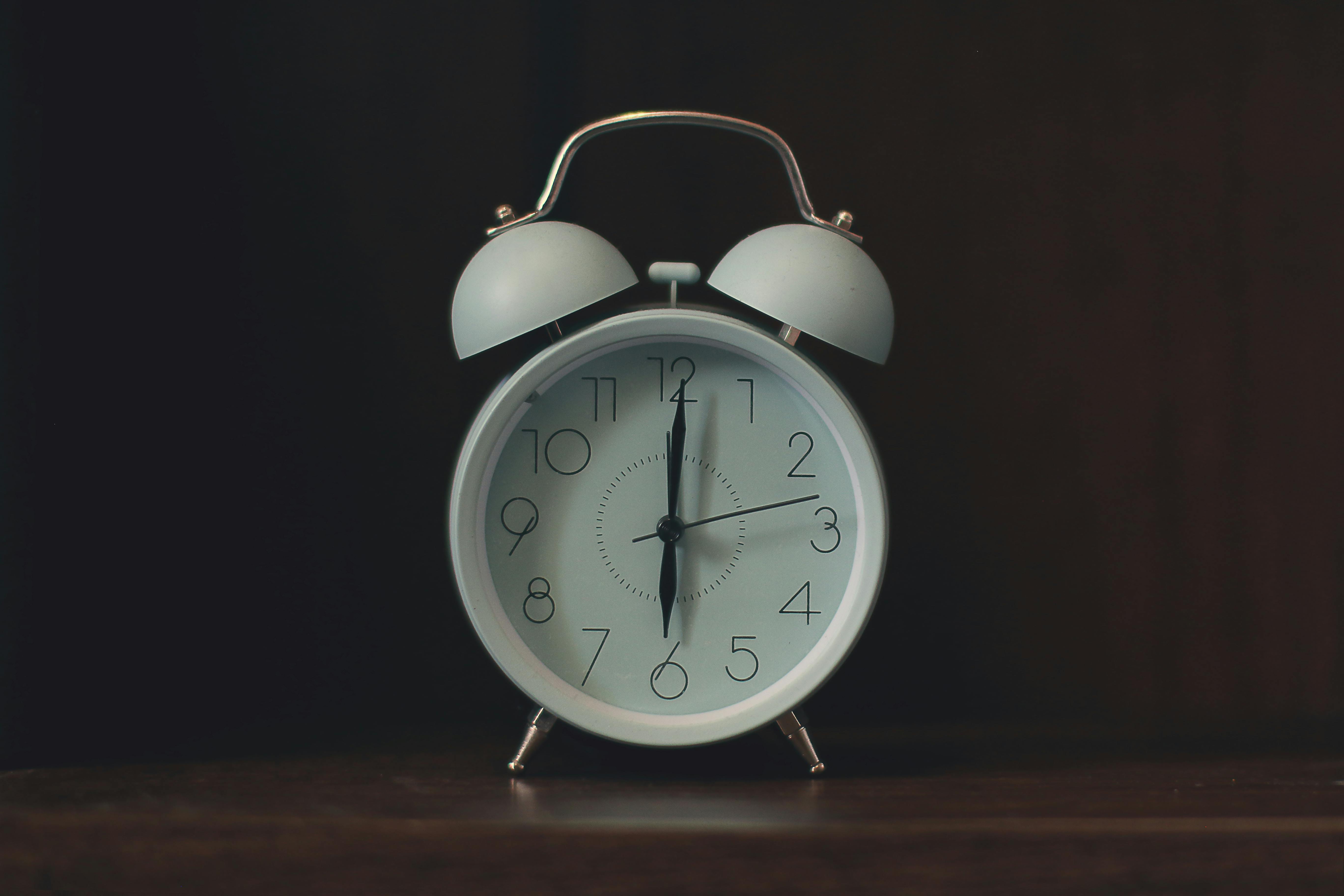 An alarm clock on a table.
