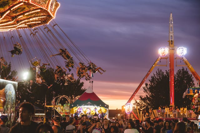 Sydney Royal Easter Show: People riding amusement rides at an event