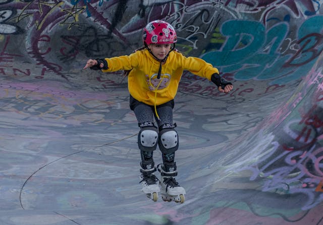 Winter school holiday activities: A young girl skating through a skate park