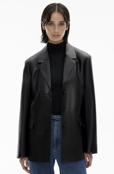 Women's coats and jackets: A model wearing the black three button blazer