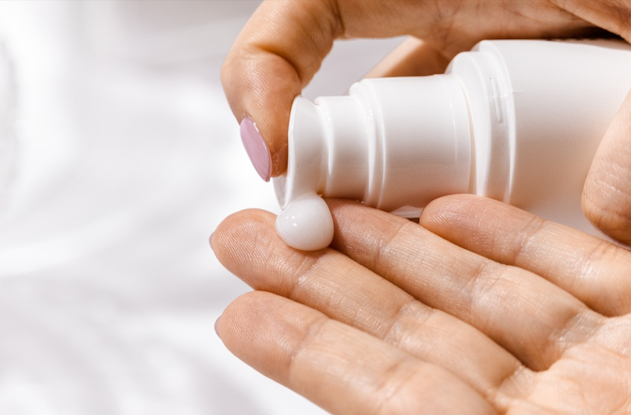 woman using one of ISDIN products for her skincare