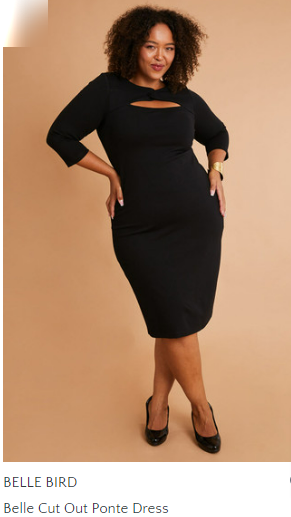 A woman wearing a black dress and black heels on a pink background