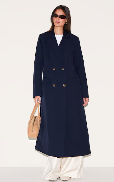 Best coats for fall: A model wearing the navy maxi length duster coat