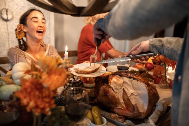 A woman receiving food at a Thanksgiving dinner