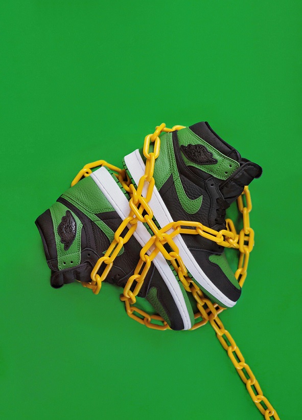 Image showing Nike sneakers on a green background.