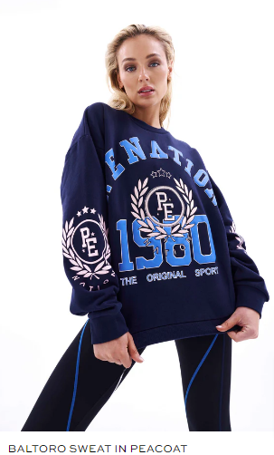 On a white background, a woman wearing a blue tracksuit.
