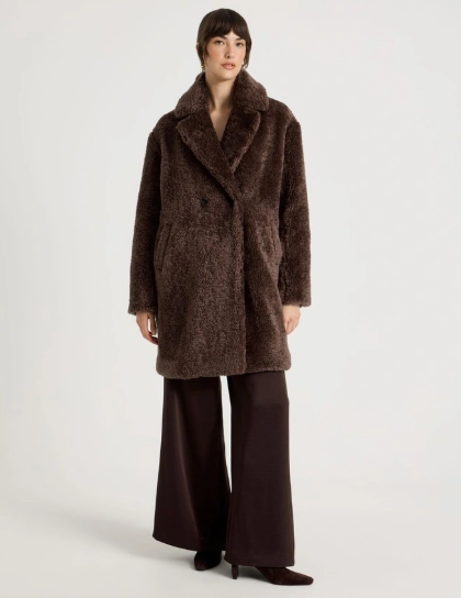 Dark brown coats:  A model wearing a chocolate brown teddy coat