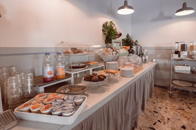 Assorted foods in buffet-style on a white table as part of all-inclusive holiday deals