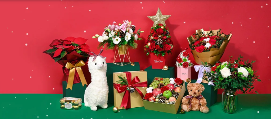 various red rose flower bouquets, teddy bears, chocolates and fruit on a red background