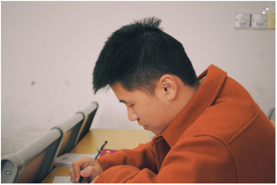 A medical student studying with exam prep material from Pastest