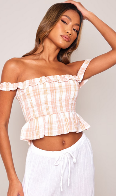 Pink Shirred Check Print Crop Top with scotch detail and white linen pants worn by a model.