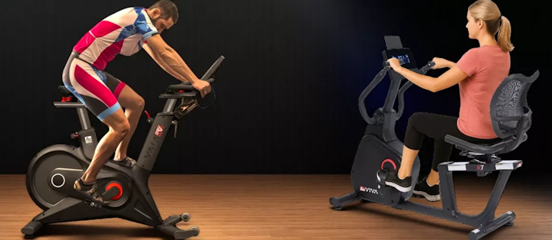 Ein Mann und einer Frau auf jeweils unterschiedlichen Fitnessgeräten