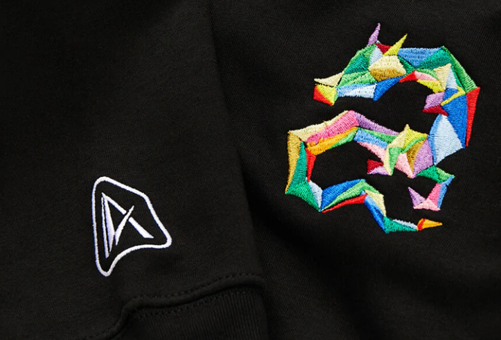 An Amea logo embroidered in white and a dragon embroidery in vibrant colours