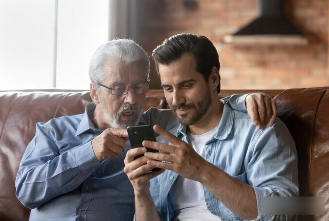 A son showing his dad to use Connor discount code on a smartphone