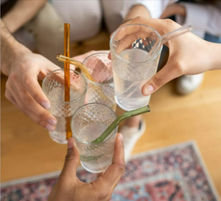 A group of people doing a toast with drinking glassses