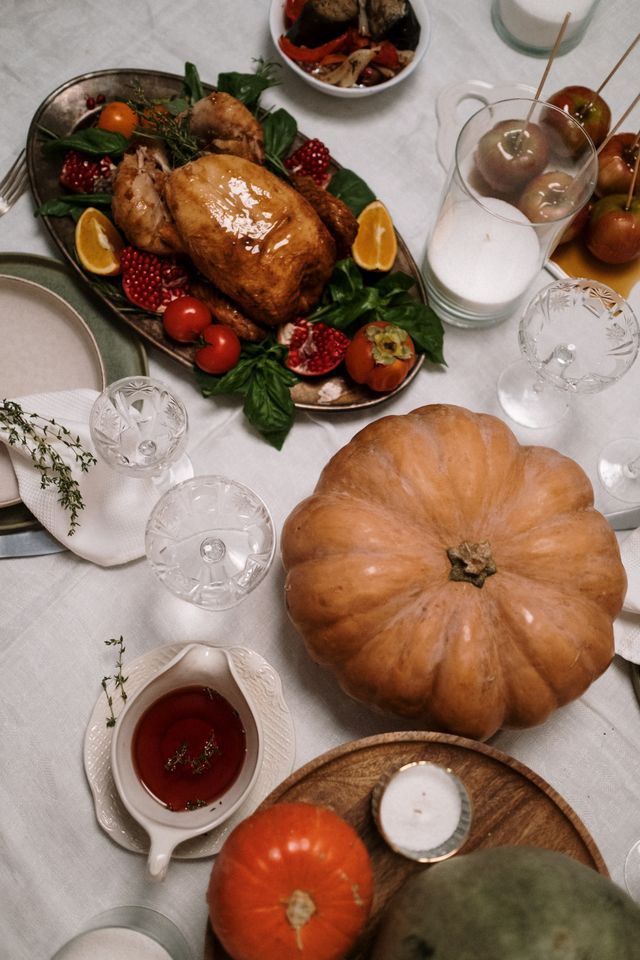 A turkey dinner set out on the tabel that someone saved on with a Thanksgiving promo code