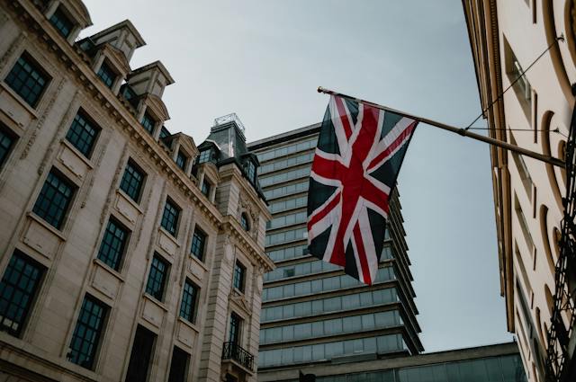 The red, blue and white United Kingdom flag hanging outside an apartment building