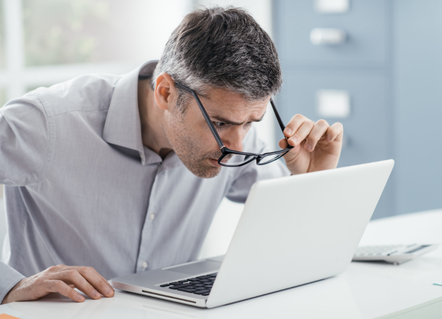 A university student's eyes light up when he sees the Rental Cover promo code on his computer