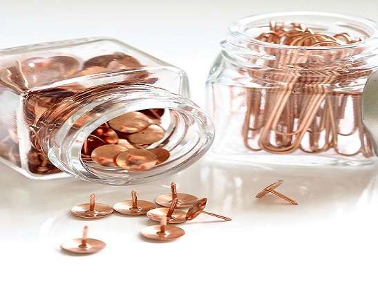 Image showing a jar of paper clips and a jar filled with drawing pins.