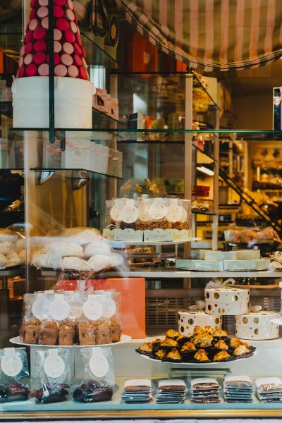 Pastries and baked treats arranged on plates and in decorative packaging