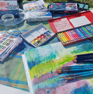 A range of art supplies and a partially completed painting
