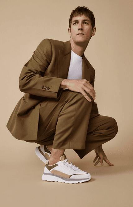 A man modelling for Geox showcasing some of their show ranges