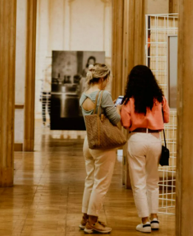 Two women inside the art museum