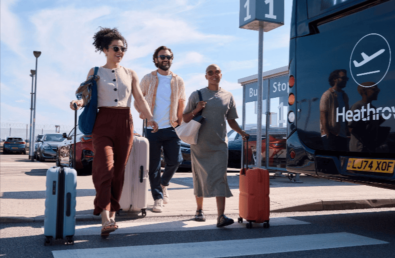 Travellers walking from the parking they saved on with a Heathrow Airport Parking voucher code
