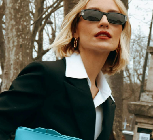 A caucasian woman wearing formal and accessories from Consigned Sealed Delivered
