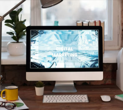 Home office desk with digital marketing website homepage created using a HostPapa plan.