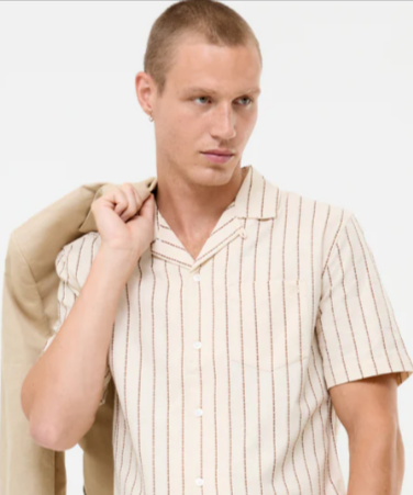 A man wearing a French Connection beige striped casual short sleeved shirt