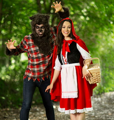 A couple wearing a little red rifidng hood and wolf costume from Halloween Costumes