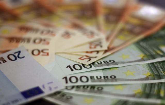 Back-to-school supplies: A variety of Euro backnotes spaced out on a table