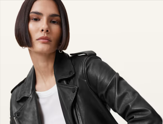 A lady wearing a leather biker jacket from ALLSAINTS
