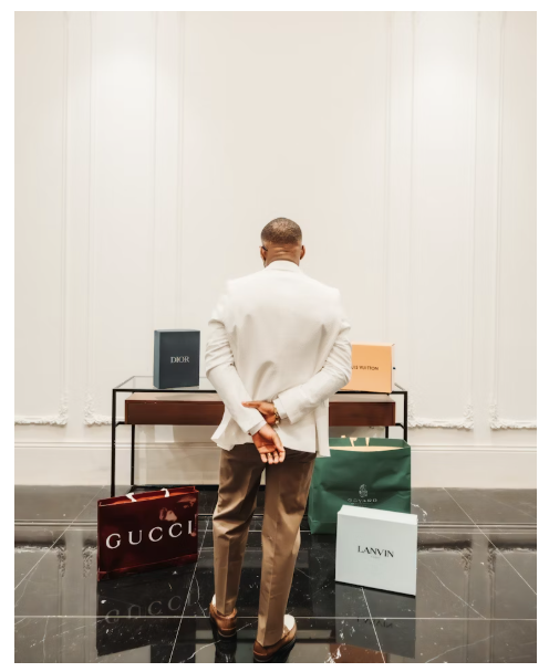 A man in a white jacket looking at his Singles' Day luxury purchases