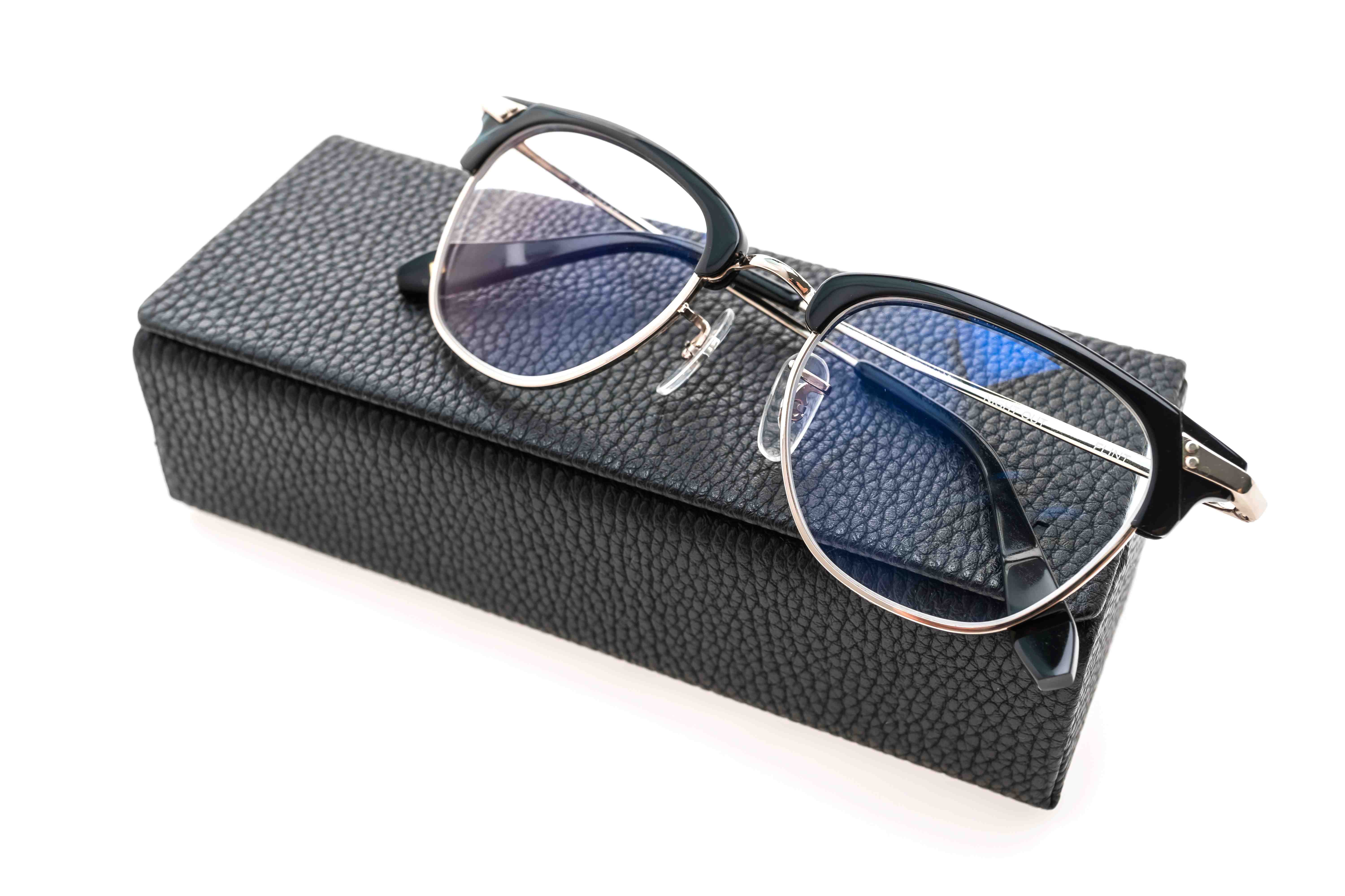eyeglasses-wear on top of a black eyecase