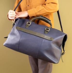The British Belt Company travelling bag on brown background