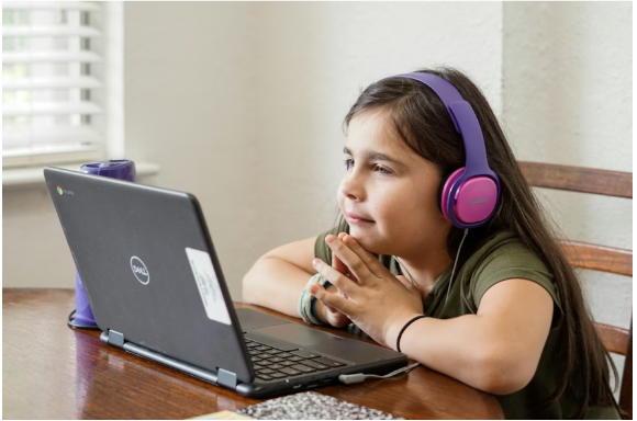 A female student listening to instructions from the Estia Tuition tutor