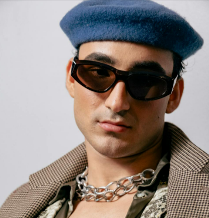 Man with sunglasses, blue beret, and accessories from Diesel