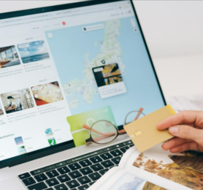 A person holding a card and booking a trip on the ESky website