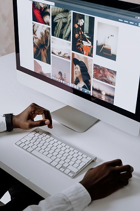 image showing a computer, keyboard and two hands
