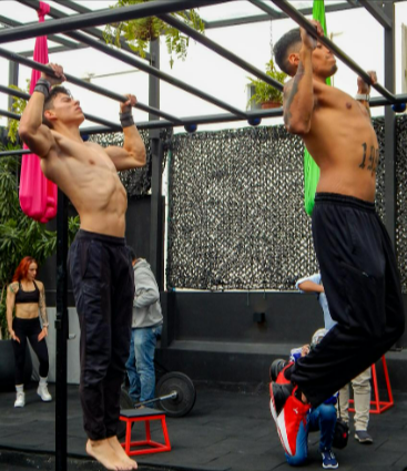 Men working out in an outside gym with resistance bands from FitKit