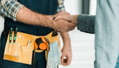 A handyman greeting a customer