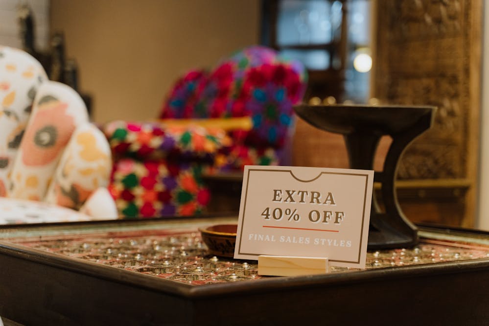 Best Black Friday deals: A sale sign on a wooden table in a furniture store