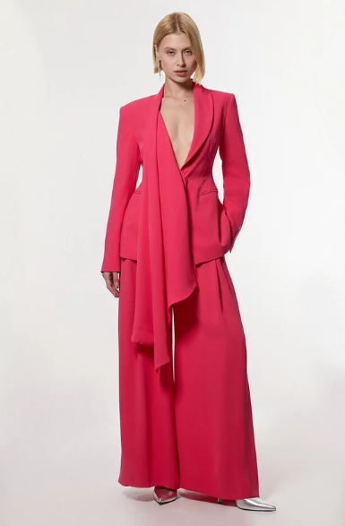 Wedding guest suits: A model wearing a soft tailored colour block suit set